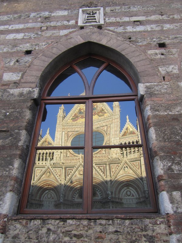 The Duomo reflected on Santa Maria della Scala