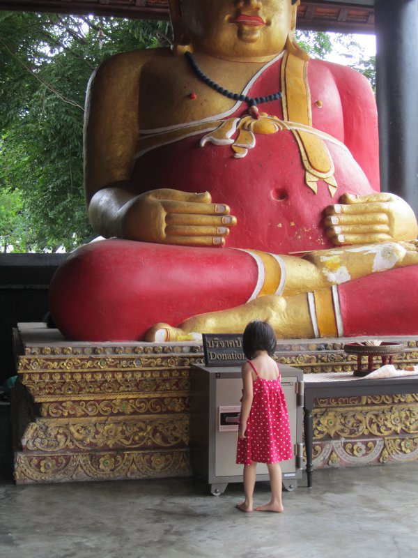 Big Buddha, little girl