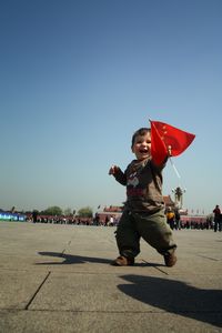 Waving the Chinese Flag in Tiannamen Square, Beijing