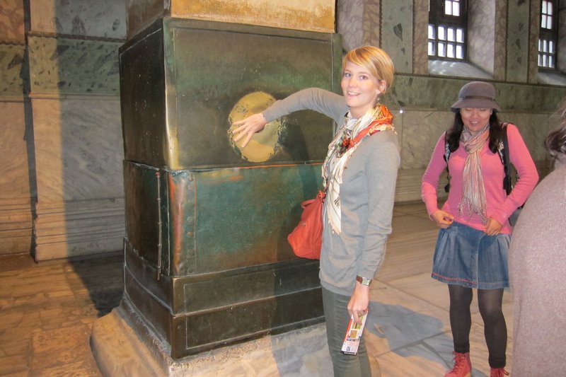 Making a wish at the weeping pillar in Haghia Sophia