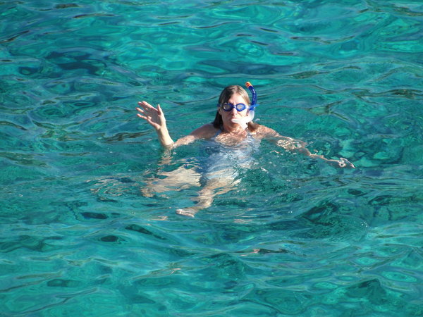 Jill snorkeling in the water near our villa