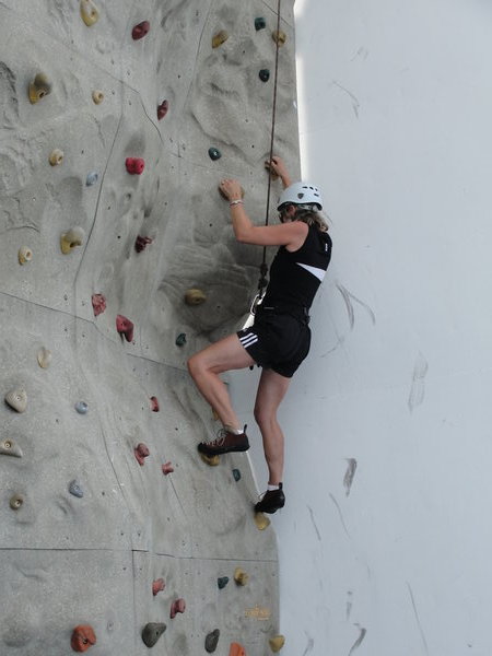 Jill rock wall climbing on the ship