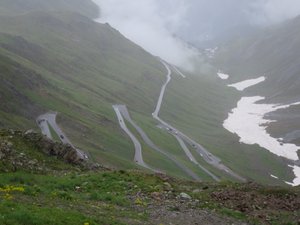 Stelvio pass. 46 hairpin bends up and down with steep drops.