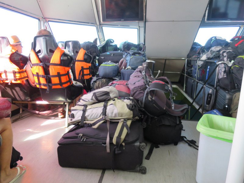 Bags piled high at the front of the ferry