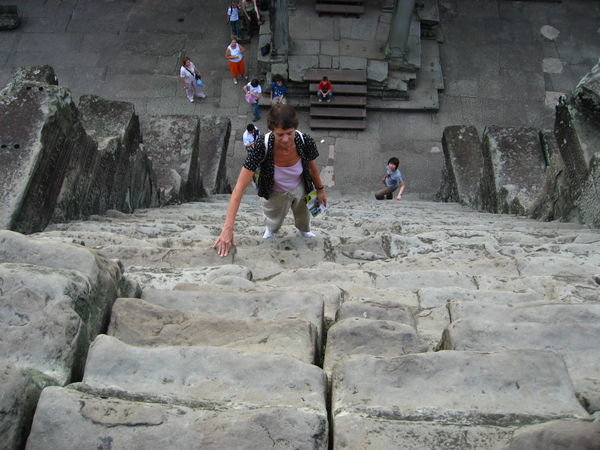Climbing the Steep Steps Of Angkor Wat