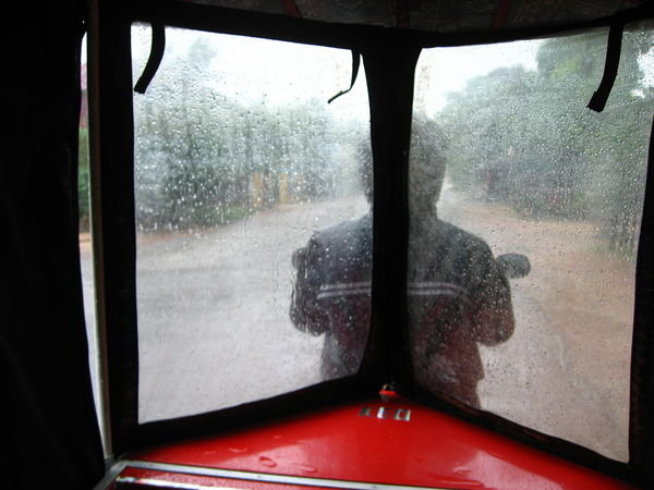 Cacooned From the Rain in Our Tuk-Tuk