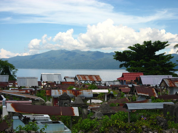 Local Graveyard with the large island of Pulau Seram behind