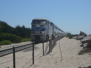The path to the beach crosses to train track