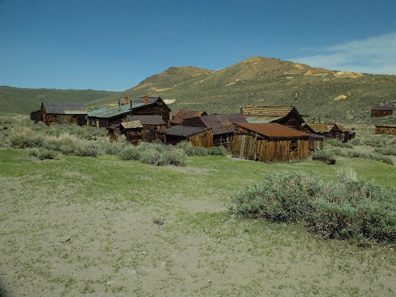 A cluster of wooden houses left as the miners abandoned  the town when the gold ran out