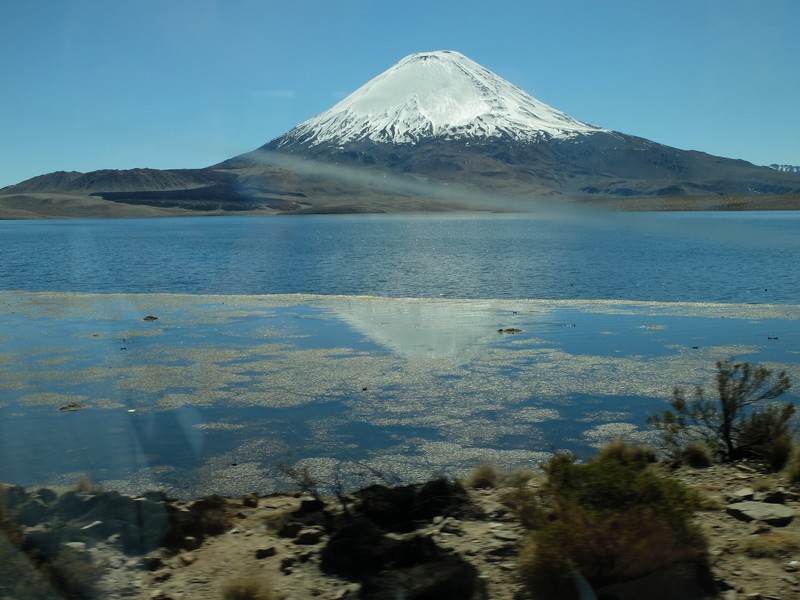Volcano refelected in the part frozen lake