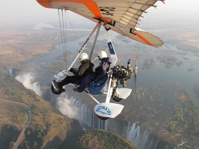 Microlight over the falls 