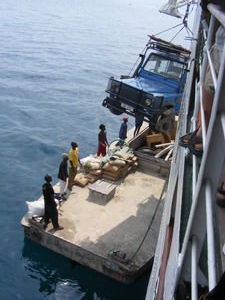 How many africans does it take to winch a jeep on to a barge??