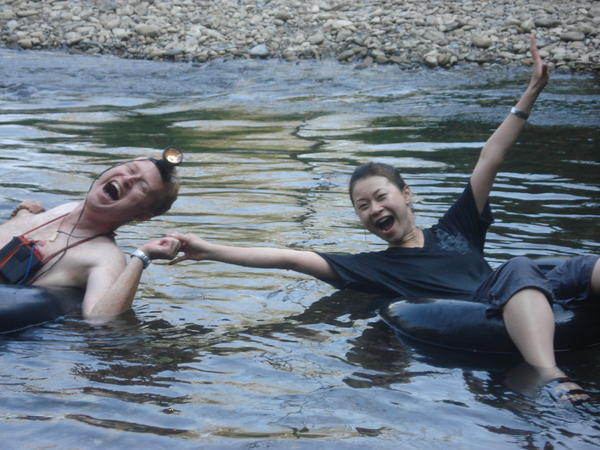 Me and a mad Taiwanese girl hang on for dear lives in our tubes!
