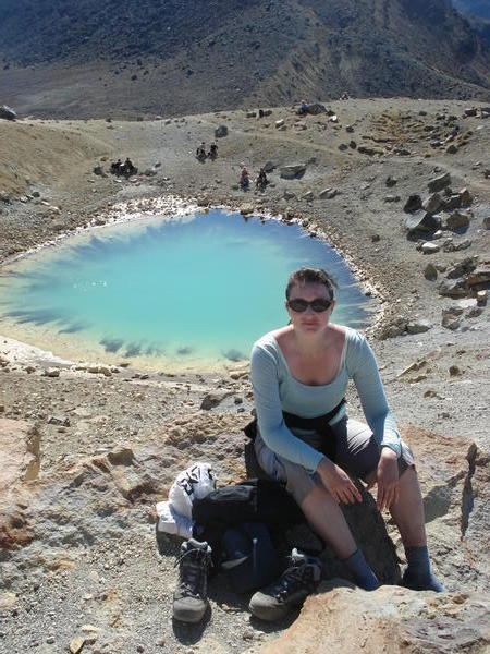 Karen takes a well earned breather at the Emerald Lakes - Tongariro Crossing