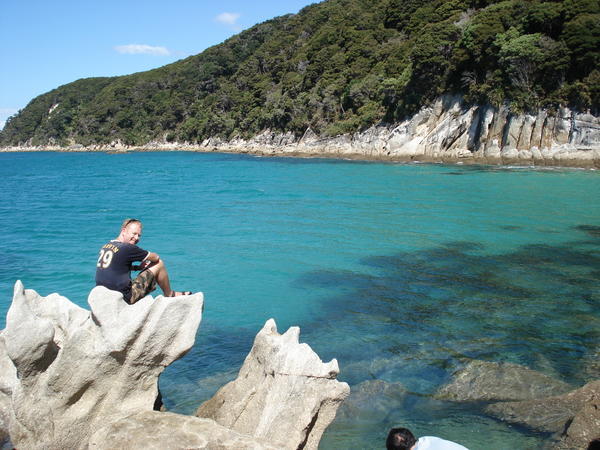 I sit on "The Throne' near Bark Bay in Abel Tasman