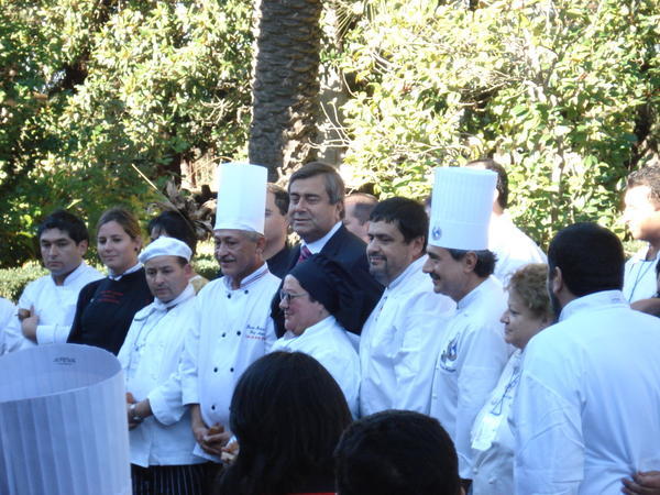 The minister of agriculture grins and bears it during the gastromic festival in Huilquilemu