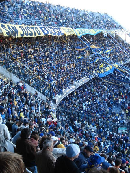 The home fans cheer behind the goal at the Boca stadium