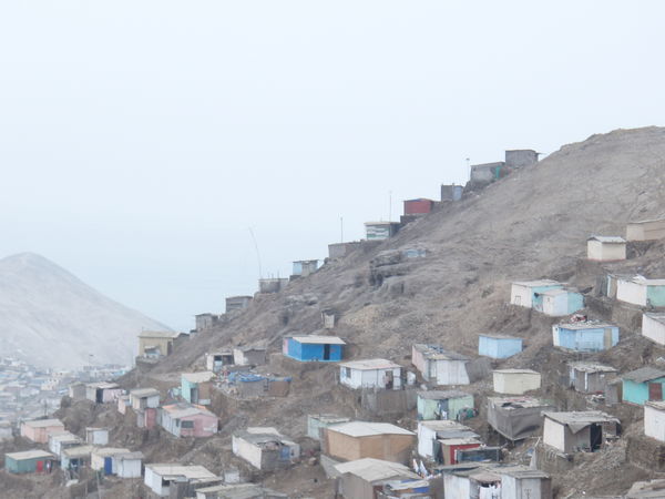 The houses pile up on top of each other in the shanty town