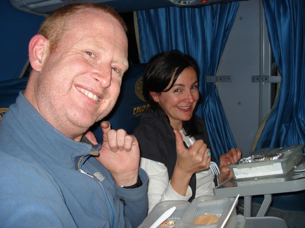 Marnie and I smile with our old-peoples trays on our bus to Arequipa