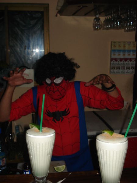 A hairy spiderman serves us our pisco sours in Olivers Travels, La Paz