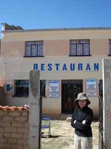 Marnie smiles outside the only restaurant open in Yampupata at the end of our walk!