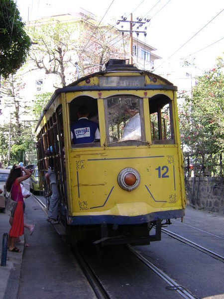 The yellow tram goes past in Santa Theresa