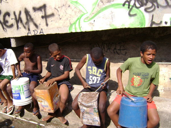 Boys give us an impromtu drum session on our flavela tour