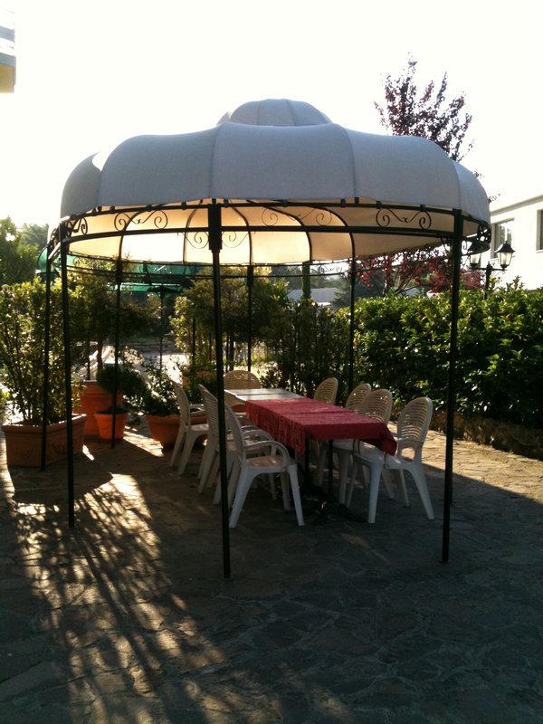 Garden chairs and gazebo in Italian hotel