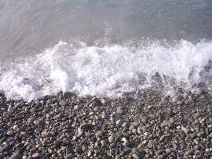 Sea waves at Nice pebble beach