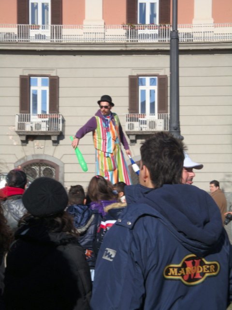 Stilted Street performer hitting kids (and parents) with plastic bats!