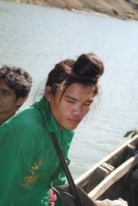 Tribal young gentleman commuting in boat