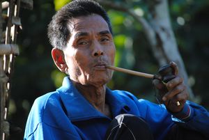 Tribal man smoking pipe