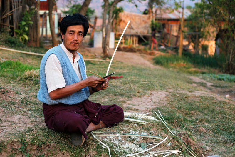 Man carving bamboo