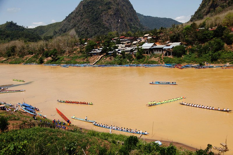 Neighbouring villages bring their boats to Nong Khiaw