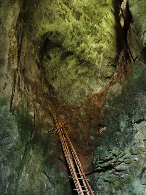 Rickety bamboo ladder is the only route between two cave sections