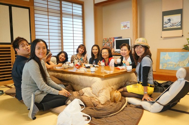 Heated table with Japanese tourists