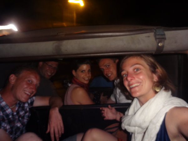 Crammed in the back of a rickshaw