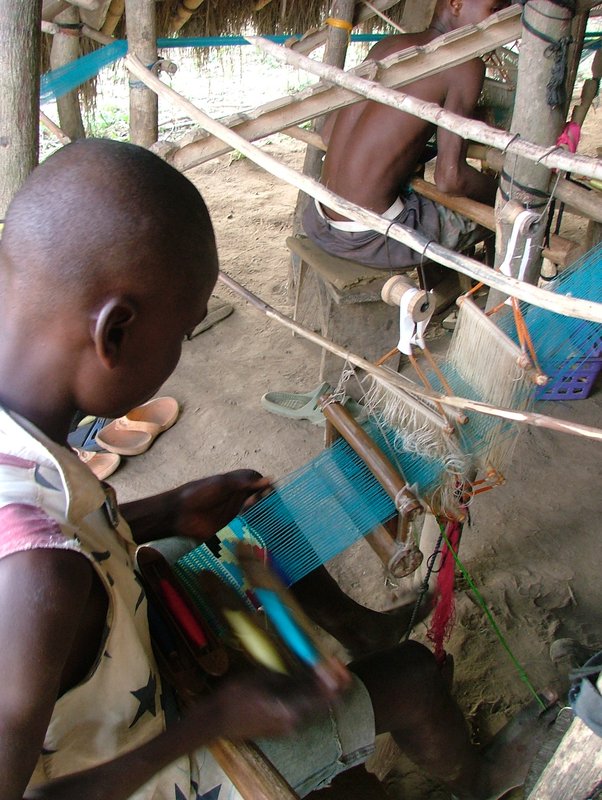 Young Boy Weaving Kente Cloth