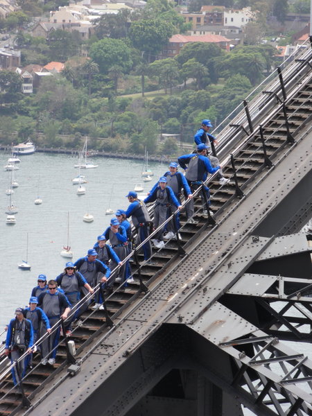 looking down on bridge climbers