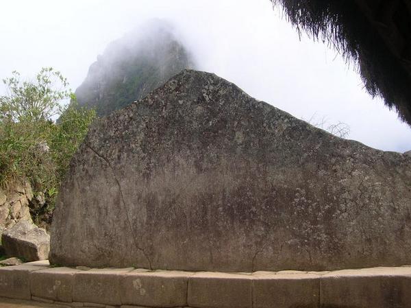 Ceremonial rock in the shape of the mountain behind