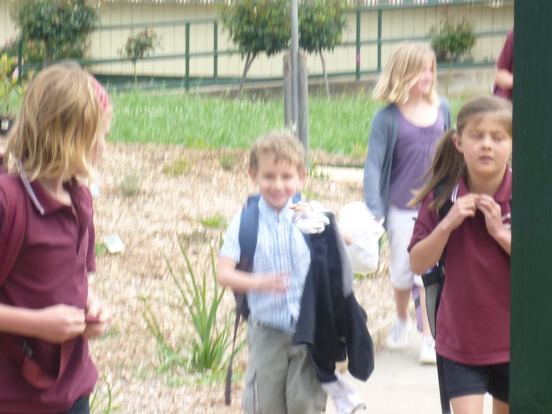 Reuben Freya and Emily coming out of school