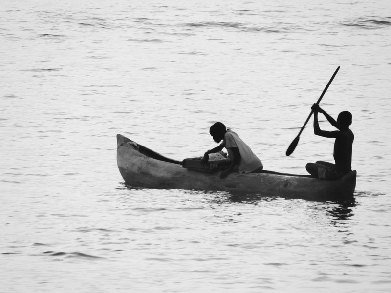Paddling dugout canoes