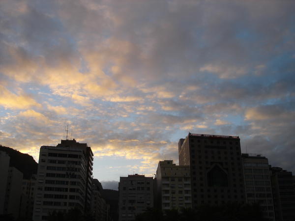 sunset over conglomerate hotels in copacabana