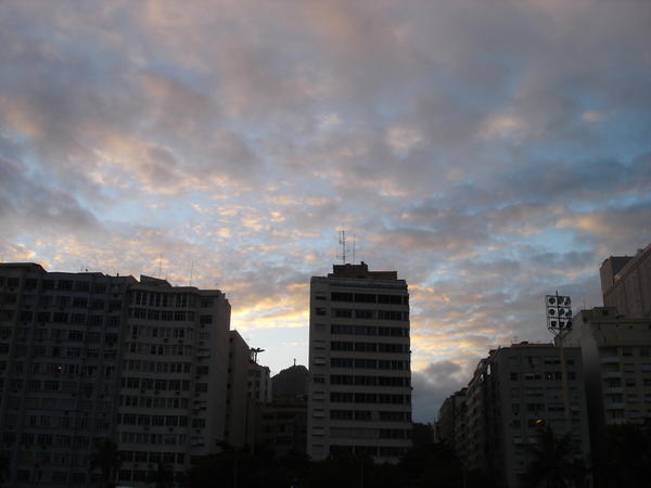 sunset over conglomerate hotels in copacabana