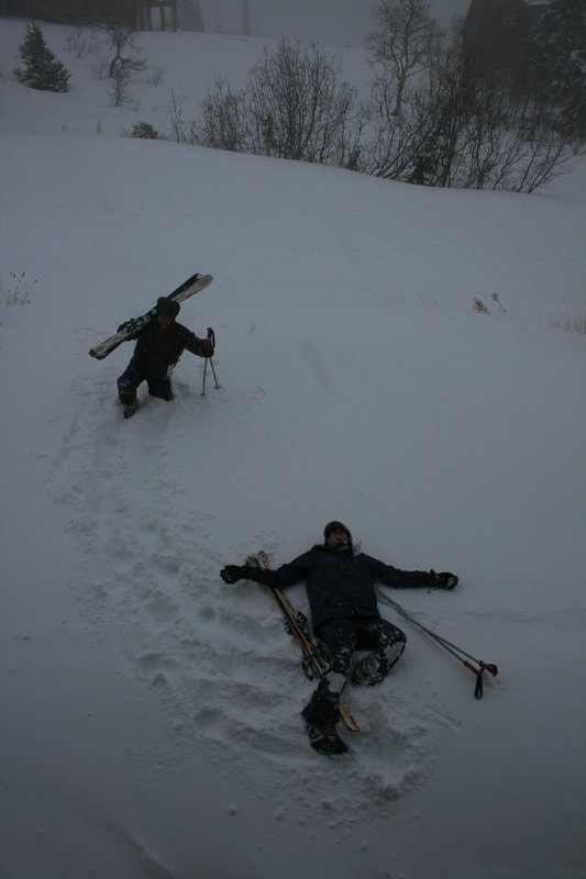 Made it home. Taylor and Michael collapse in the fresh powder