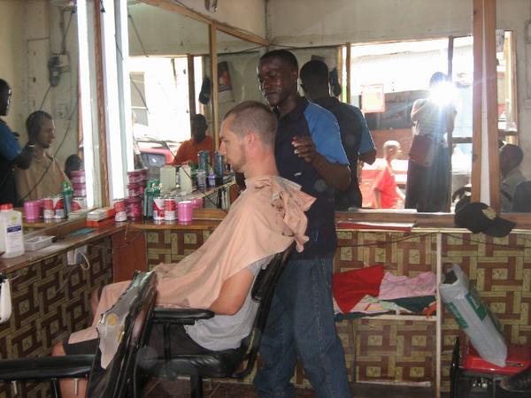 James getting his haircut at the Mexico Hair Salon