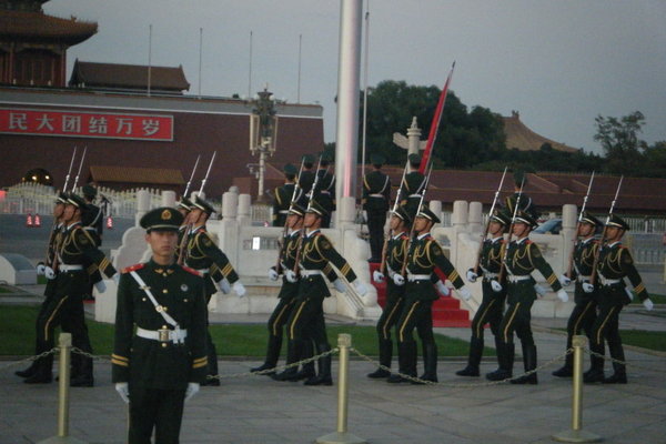 Soldiers marching to the flag