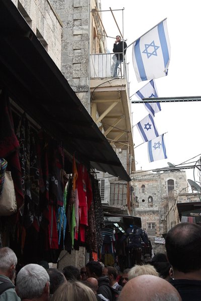 Israeli settlers and their flags inside the Old City