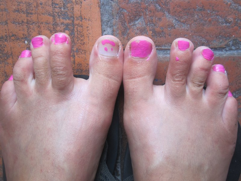 I let a guest at the hostel paint my toe nails, he painted a smiley face on one toe -this is what happens when there's a slow day at work