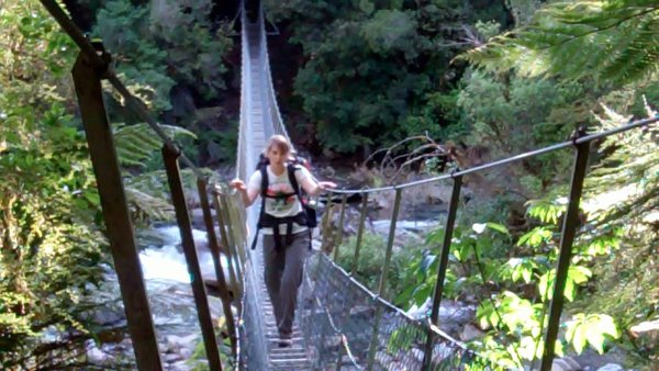 Kate conquers a swing bridge
